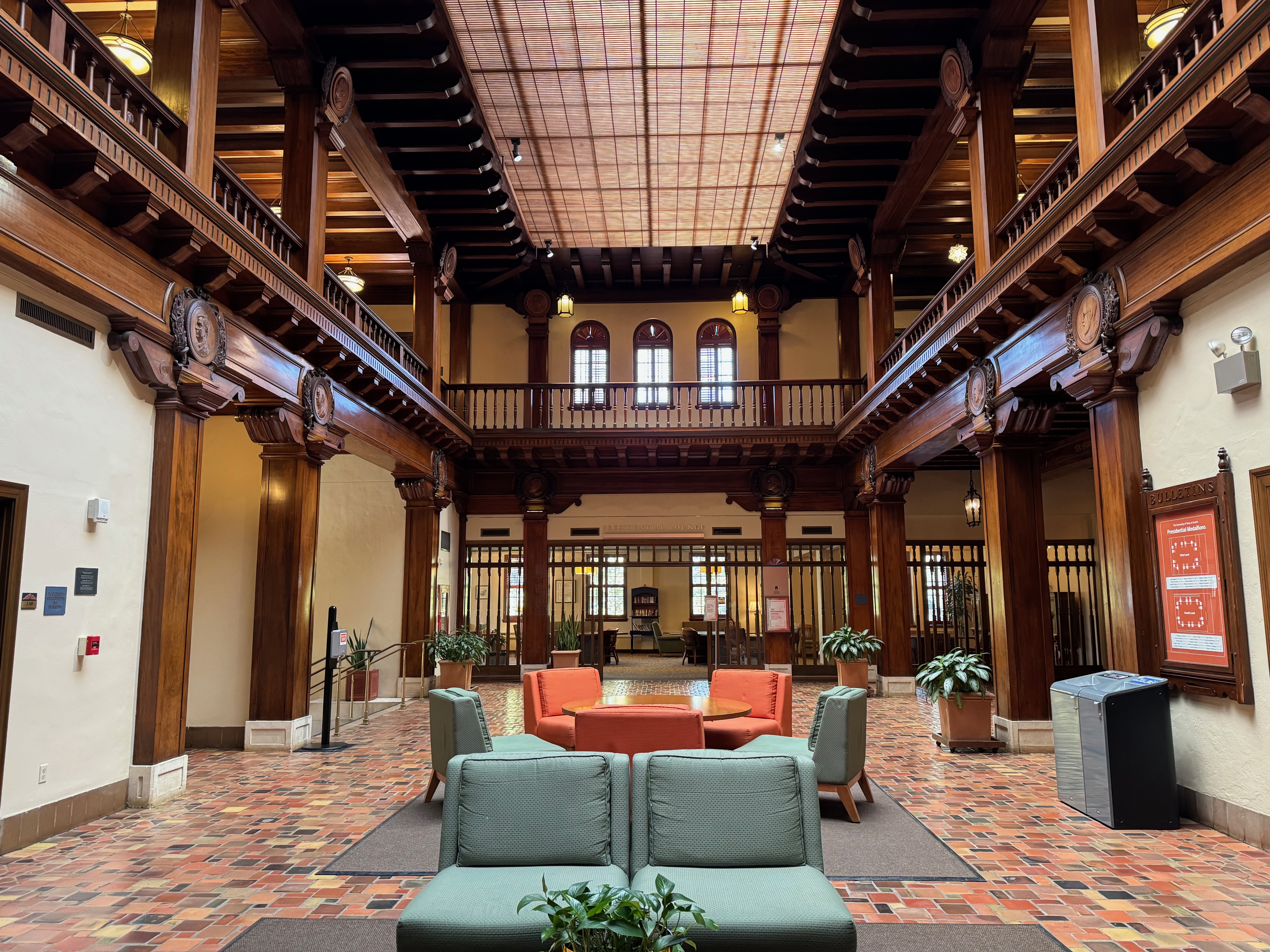 Historic UT Austin building interior with wooden balconies