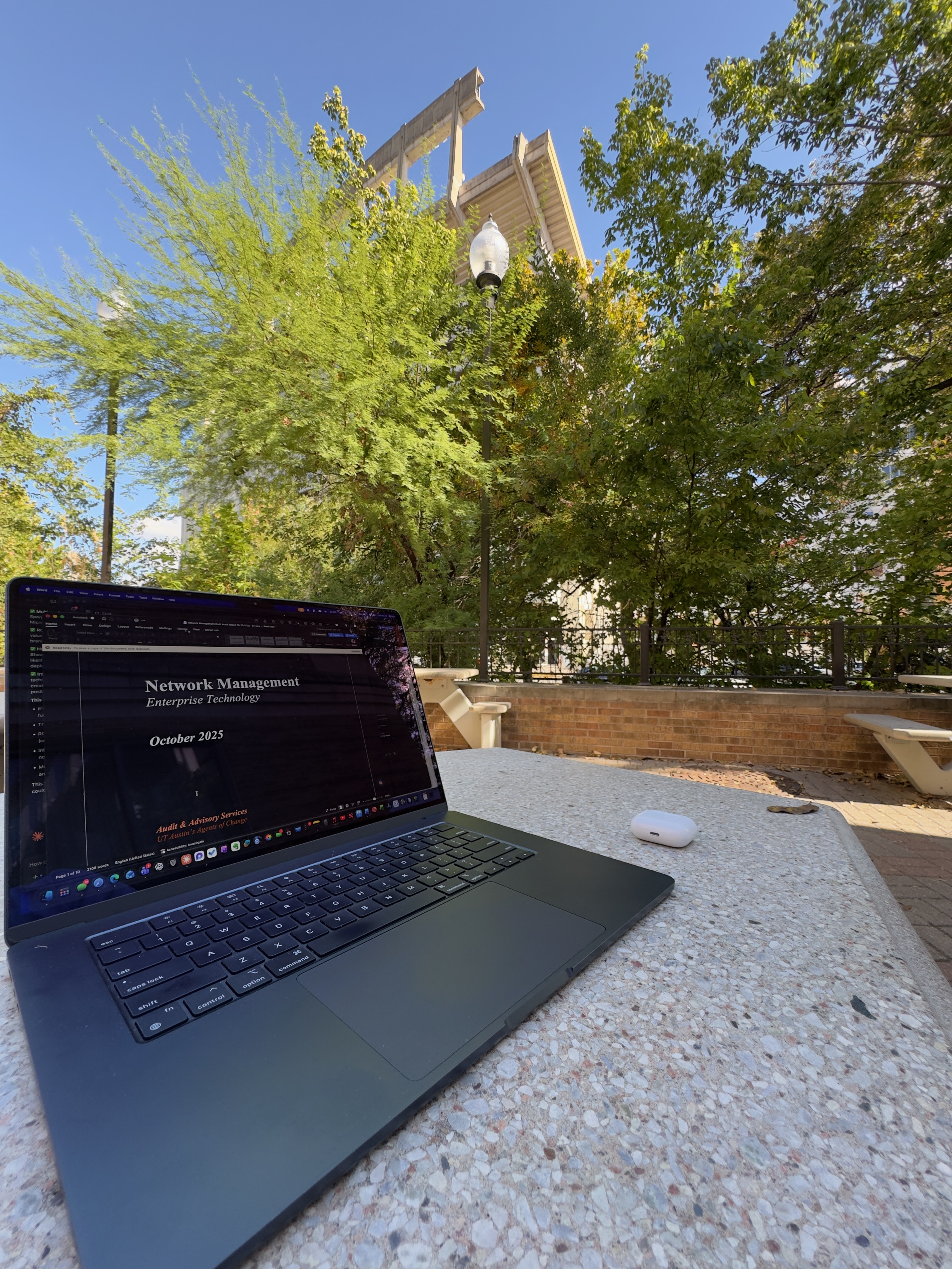 Laptop open to an Enterprise Technology presentation on the UT campus